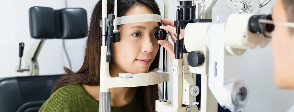 young asian woman having eye exam