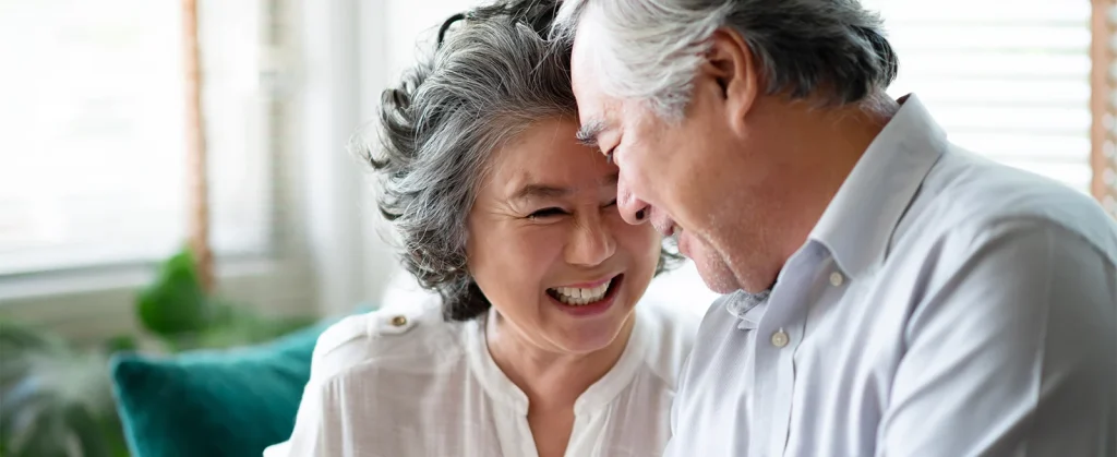 happy senior couple laughing together